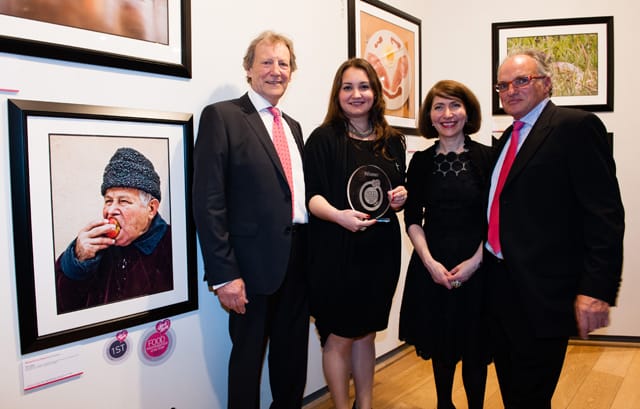 Group Of People Smiling & Holding A Photography Award