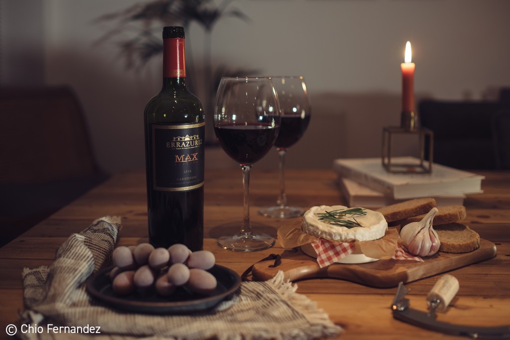 cheese and red wine on a table
