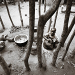 Jodi Hinds - Ugandan Child Cooking in their Kitchen